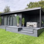 an upgraded composite garden room with bespoke decking and flyover to house a jacuzzi