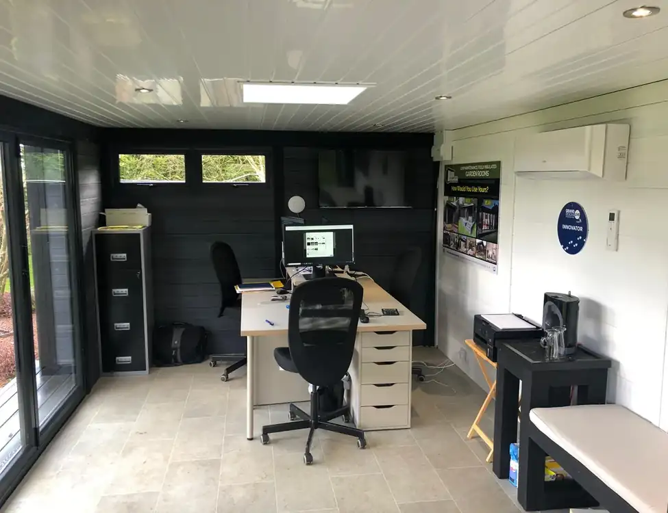 Composite garden office with desks and skylight